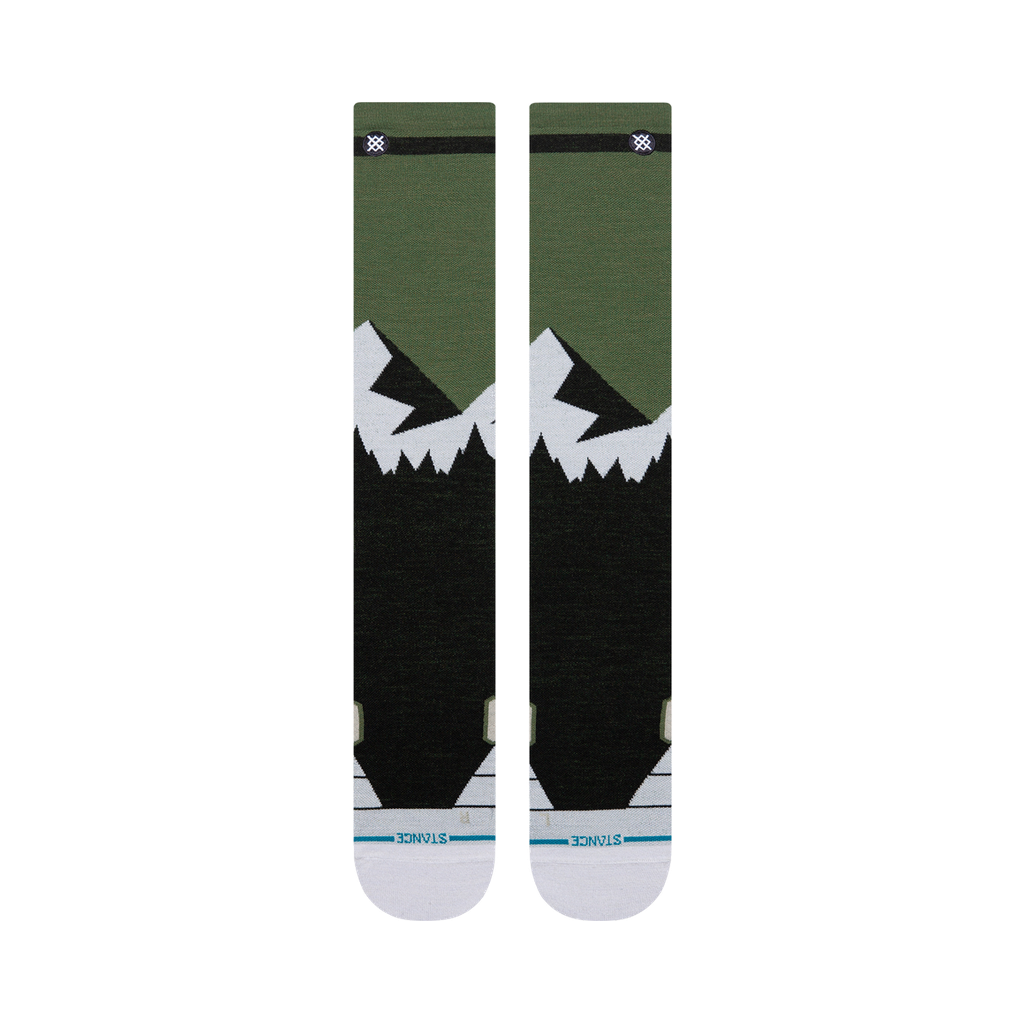 Bas de neige Stance Divide Ultra Light Wool Black, motif de montagnes vert et blanc — paire à plat, côté logo.