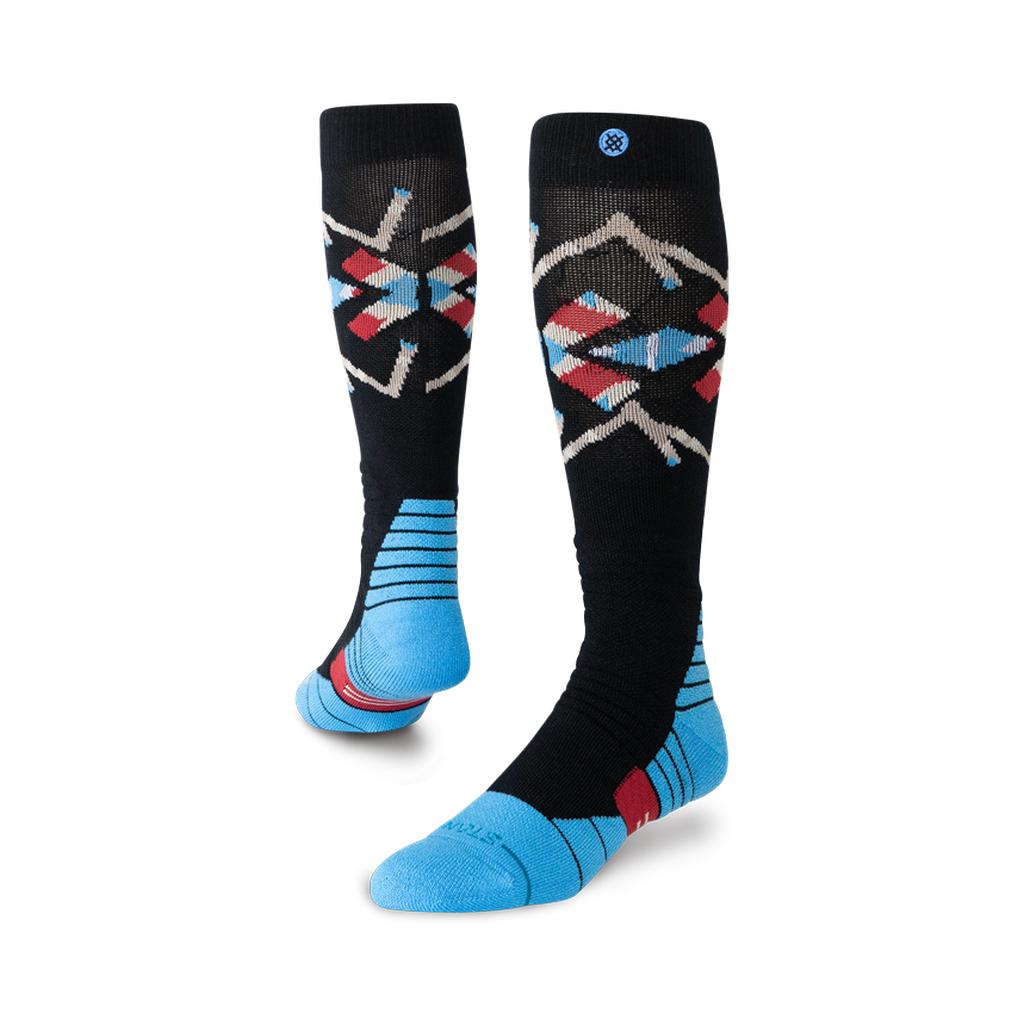 Bas de neige Stance Breaker Mid Poly Black, motif géométrique et pieds bleus — paire présentée en volume.