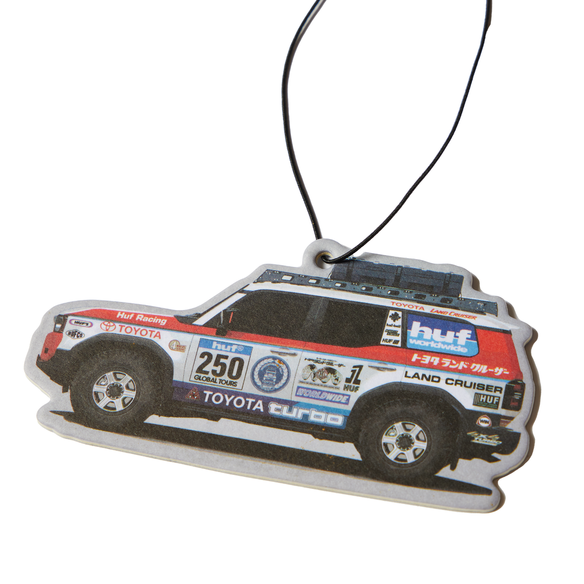 Désodorisant HUF x Toyota Land Cruiser multicolore en forme de véhicule de rallye — détail du véhicule imprimé.