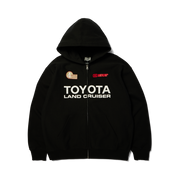 Hoodie à fermeture éclair HUF x Toyota Land Cruiser Heavyweight noir — vue de face, fermeture fermée et imprimé Toyota.