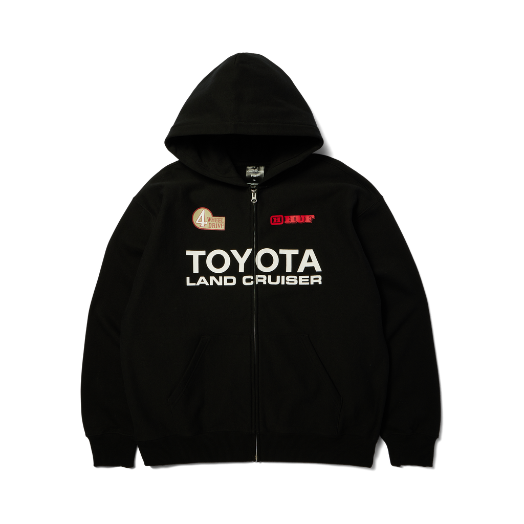 Hoodie à fermeture éclair HUF x Toyota Land Cruiser Heavyweight noir — vue de face, fermeture fermée et imprimé Toyota.