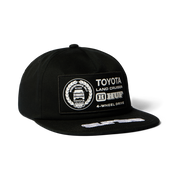 Casquette HUF x Toyota Land Cruiser Rally Snapback noire — vue de face avec écusson Toyota.